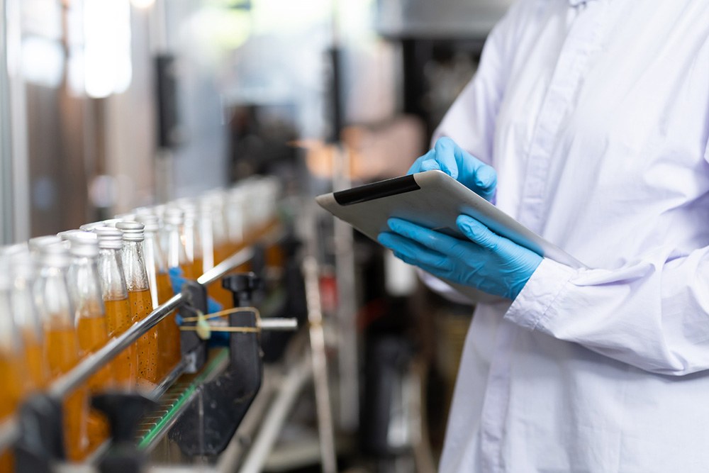 Scientist checking vials and caps filled for beverage quality testing.