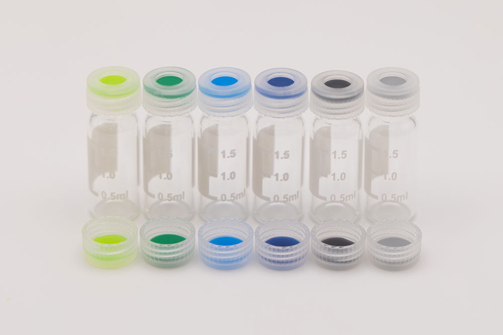 PFAS-Color-(1) Row of six clear graduated vials featuring translucent caps with multi-colored PTFE septa