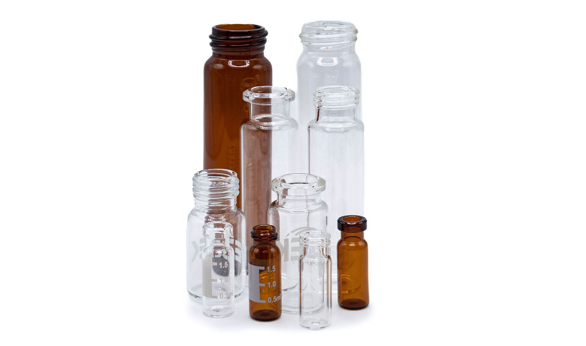 TiffVials-12 Group of empty clear and amber laboratory vials of varying sizes without caps