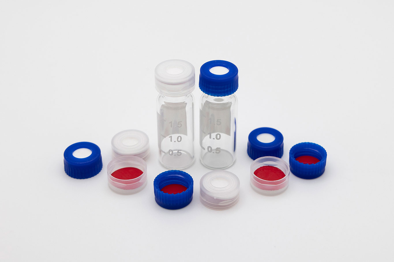 ilt01.02-2-(2) Clear graduated vials surrounded by blue and white caps with visible septa